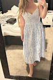 It's cute without a doubt, but it's a lot more blue than depicted here; it appeared as though it would be subtle, but it's very bright, not as bridal shower appropriate as I'd hoped. Additionally, it does run large, lots of extra room in the bust width-wise. - Sarah P.