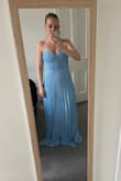This dress was great! It gave the perfect boost in the chest and lay perfectly over legs and stomach area. The pleats are super flattering, so I'm excited to wear it to the wedding I have soon. It was too long for my 5'1 self, but a quick alteration had it ready to go! - Kenley G.