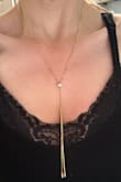This is an absolutely stunning piece of jewelry. I purchased it as an addition to my resortwear and it does not disappoint. The necklace is adjustable to be as loose or tight around your neck, and pairs well with nearly any outfit or swimwear. Highly recommend - Lisa C.