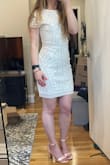 Got this dress for my upcoming graduation and it's just gorgeous. It feels high quality. Bought in an xs originally and it was too tight in the hips and arms. The small fits great and I am able sit and move around comfortably. - Megan R.