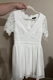 It was cute but I have a pear shaped frame so it flared more than I wanted it too. Very high quality material. Bought for a baptism. - Emily L.