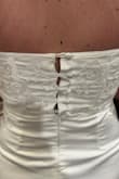I have larges in others but after reviews I got a medium. It zippers perfect but the back buttons are a little tight. I'd recommend checking your measurements as if I ordered up way too many adjustments would need made. - Cheyenne A.