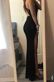 Beautiful dress! Fits true to size and very flattering. May need to get the leg slit altered so it is not so high on my thigh but not a huge issue. Material hides any imperfections. - Riley R.