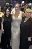 This dress was truly a stunner! Wore it to a gala and got so many compliments on it. Had to loosen the ties in the back to get it on, then retighten it. It has a layer underneath so it was not see through or sheer. Did not wear a bra with it. The only issue was the glittery tassels rubbing on my under arm, but it was worth it for a few hours to wear this beautiful dress! - Colleen T.