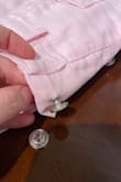 The buttons on this are not the correct buttons for this fabric. 3 buttons have broken off and pulled through the fabric the first time I wore them. - Caitlin M.