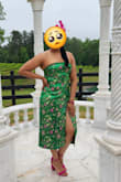 I bought this dress to wear to a Kentucky Derby party. I received many compliments on the dress. It is a gorgeous shade of green with pretty fuchsia accents. However, after having it on for about 3 hours, I noticed it was pulling apart at the seams. I could not get home fast enough! Also, the rubber around the top of the dress kept folding over. I was tugging at the dress the entire event. I was really hoping to wear this again, but unfortunately have wasted my money. - Erica P.
