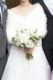 I was worried that, since it was faux-fur, the fur would fall out a lot, but it thankfully didn't! It's super soft and warm. I had my wedding ceremony outside, and this really kept me warm. - Emily C.