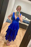 I'm usually between an XS and S on here, but I went with the XS due to the low cut and the fact I'm fairly flat-chested. The fit was perfect! It was a little snug right under the bust but not uncomfortable. I got tons of compliments on this one! I did end up stitching the front together just a little, so I didn't have to worry about the girls falling out on the dance floor - Caisey B.