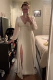 I bought this for my bridal shower, and it is absolutely stunning. The fabric is nice and thick, not see-through. I love the slit and the lower back - Emma M.