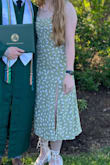 I wore this for my brother's graduation, and it was perfect. I normally order a medium, but I ordered a small in this and it worked perfect. The back is stretchy. - Peyton A.