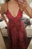 Beautiful and bright color! Sexy, but not too much, dress cut. It has a hot pink/magenta underlayer with a cool purple floral organza layer. Does run small around the midsection and has no give. I'm usually small across the board but went up to a medium, and it fits perfectly around my lower rib cage. Thin adjustable straps are nice. Bust is a little looser. I need to steam the organza flatter so it's not so poofy in the bust. I also stitched the cleavage area up a little for more support since it's loose for me. The photo shows after I stitched it up. Otherwise, it's a deeper V cut. I'm 5'2" so I knew I'd have to hem it. So excited to wear it for two weddings this year! Yes, I am wearing this dress to multiple weddings. I love it so much, and it's versatile for the seasons. I may throw on a blazer or shrug if it's chilly. Would recommend if you don't mind doing some modifications. - Teresa S.