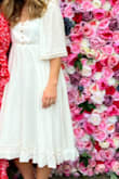 Wore this to my bridal shower, and it was perfect! I would say it runs a little large on top. I usually wear small or medium, and a small was on the bigger side. If I lean forward, you could see everything, though I am very small chested. Still very cute though! It does wrinkle a lot so I needed to iron - Julia B.