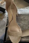 The material of the shoes makes them uncomfortable to wear. - Jenny L.