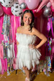 It's honestly comfortable other than the tulle that's in your armpits. It was really helpful having the grip lining on the top of the dress. Try not to sit for too long in it though or else the tulle will fold and wrinkle. - Jenna M.