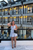 this dress is on the shorter side for sure, but if you have short legs/torso like me, it will be perfect! wore shorts under for safe measure, but still so cute! - Jenna H.
