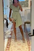 This dress was perfect for cocktail attire in a beautiful garden. It runs small; the fit was tight, but I wouldn't size it up as it would have been too big on the shoulders and bust. It was difficult to zip up but found a hack when I reversed the dress; zipped it up on the front, then turned the dress back around and slid the shoulders up. I felt very feminine. The dress is in fact short, but the long flap on one side keeps it classy. - Maria R.