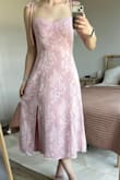 The fit is as expected, ordered a size Small. The material will be great for hotter months. A little sheer if wearing darker colored undergarments, but not see through. Ruching in the back helps with fitting multiple sizes. - Tiffany I.