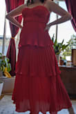 I really like this dress. The material is nice and flowy so when you are dancing or walking it swishes around and looks good. It also is good for the heat since it's airy. The dress is pretty true to size, and was a little stretchy. It ends mid-calf on the model since they are super tall, but for me was right at ankle length. The only downside was the terrible zipper which is a hallmark of all the dresses I have gotten from Lulu's, which gets stuck at the waist seam and is a pain to open or close. I will probably have to fix it at some point. - Casey N.
