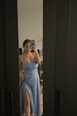 I bought this dress for my boyfriend's graduation, it was so cute and worked with the heels I was wearing BUT if you are shorter and not wearing heels I would definitely recommend getting it tailored. Also I have a bigger like bra size so it was kinda tight up top so in order for me to not look like droopy or saggy I tied it a little tighter but after awhile you do get red marks so I would watch out for that as well. Besides that the bottom fit perfectly and I am a 33" in the hips so getting a small helped the form fitting look I wanted! - Hanna L.