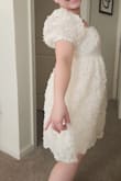 Bought this for my bridal shower tea party and I feel like this is absolutely on theme for a spring or garden theme. My only issue is a lot of fraying on the floral embellishments so hopefully I won't be losing them like confetti on the day. I will say the bust is not for bigger busted ladies because I'm not that large and this was the tightest part of the dress while everything else was pretty oversized and poofy. - Eliana C.