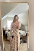 I really love this dress - the main downside is how loose the bust is. I'm kind of small-chested and this dress really showed it. It was so flowy, I was anxious all night that my boobs would come flying out. Besides this, it was comfortable and cute. Wish the top was tighter. - Hannah B.