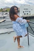 The dress is beautiful the color the fit the flow of the dress when the winds blows. I was nervous about the bust area, I felt it was a little too loose but not once did I have any peek a boo moments.  I wore this for mother's day on a brunch cruise and I definitely turned many heads wearing thjs dress. I felt and looked like a princess - EBONIE S.