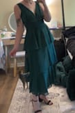 I think it fits perfectly except for a few minor points! I have a small band size (actually a 30 D) so I will need to take the cups in slightly or use dress tape, and will need to shorten the straps just slightly. I love the tighter fitting under bust and that the dress flows out so my wider hips aren't squished. The material is very nice and seems like it will be breathable and flowy enough for two outdoor weddings I have coming up! The length is perfect as well. - Alice S.