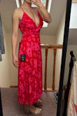 The dress is absolutely gorgeous. Vibrant colours. I'm 156 cm and this is large for me, but I love it. - Mariela