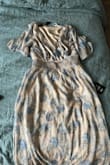 Beautiful dress that sits well and is flattering. - Kimberly C.
