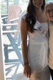 I thought the dress was very pretty! I did use tape on the side that had no shoulder strap to make sure it stayed in place. I loved the front tie! The dress was stretchy, but you could see the fabric stretch wrinkle a little in the front. It was perfect for my bridal shower! - Alexandra A.