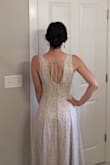 Ordered a Small.
This dress fits me so well. As other reviews say, it doesn't have any stretch so the bodice is very fitted. I ordered this dress for a summer wedding and figured I'd need to make some adjustments since I am petite. The shoulder straps were just a bit long for my frame so I had them trimmed and re-sewn. This helped bring the bodice up a bit too.
Love the back. I shopped around to find the right bra/shapewear. I recommend finding a lightweight bodysuit with a low back and built-in bra.
I'm excited to wear this! - Ruthie H.