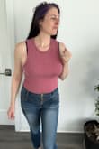 This is a great top for spring/summer. I love the vibrant color and texture of the ribbed fabric. It has a little bit of stretch, and isn't too thick. I like the higher neck, and the arm holes are not too tight/too loose, so no side boob is visible. I ordered a large, as I have a longer torso and like my midsection covered. - Carol M.