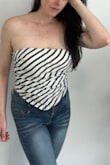 What is it about Summer and stripes? I loved this top the moment I saw it and had hoped it would fit well. I ordered an XL at first, as I thought it looked like it would run small. Exchanged for the Large and it's a much better fit. There is a zipper on the side for getting this top on easier, as you need to pull it on overhead. I love this classy look paired with white pants or jeans, it looks great either way. Was looking for some more breezy strapless tops with a classy look. - Carol M.