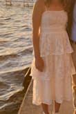 I got many compliments on this dress and loved wearing it for graduation! The fabric is soft and breathable, and the bust is formfitting and flattering. My only complaint is that the bust area is a little more see-through than I'd like, but I was able to wear a sticky bra to fix this problem. - Elizabeth W.