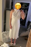Such a simple but elegant piece. The fabric is really nice and flowy. The waist line is great and falls nicely. I thought it was going to be stretch and it isn't thankfully. I also love the asymmetrical neck line. Will be perfect for our private exchanging of vows before the wedding! - Ryan W.