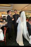 Buying things online, especially my wedding reception dress, is so scary! My husband and I eloped and then had a small family reception dinner a couple of months later. I wanted simple and classy, and this dress was everything I wanted. The back is beautiful; the sleeves were a little long but in a good/modest way, and the train was the perfect length (the tailor did not touch the train). I had the front hemmed bc I wore flats. So happy I committed to this beautiful and elegant dress. My chest is small, and there was definitely room for a bigger chest, too! I don't have my prof pics back yet, but hopefully, these pics prove something 10/10 (and I'm normally picky). - Wendy N.