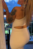 I usually don't like wearing white, but this dress was perfect! Material is thick so it holds everything in place and doesn't show any imperfections.  Simply perfect! I got a lot of compliments! Definitely recommend.  I bought size SM because I like a tight fit. I'm glad I did because it's just right.  I want to order other colors. - Yessica O.