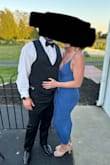 This dress was fun and sexy. My husband loved it! I tried to wear sticky tape on my boobs, but it wouldn't stay; honestly, I didn't really need it unless I was dancing like crazy, which I was half the night.I just needed to be cognizant of slippage on one side. I have a slight belly from 2 babies in 2 years recently, and this hid it pretty well, along with some tummy-sucking thong panties. Only reason I didn't give 5 stars: the little skirt underneath it (thank God it's there) could be a little longer. I was pulling it down a lot, just even while walking. Could be because I have athletic thighs and quite the booty, but I think a large would have been too big on me. Overall, I liked the dress and got lots of compliments on it. - Amber P.