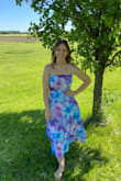 I received this for Mother's Day and it's my new favorite dress! I'm small in my upper half compared to my thighs and butt and I had no issues with it being tight on my lower half. I think if your larger in the breast area it might be too small because it fit me like a glove and I'm not blessed in that area lol. Overall I think the dress is so beautiful where you can dress it up or down and it wouldn't look out of place. - Heather G.