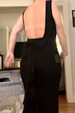 This dress fit like an absolute glove. I'm 5'2" and was able to wear 2" heels, it hit the ground at a perfect length. I would say if you're a taller than 5'2", it would be like it is on the model(mid shin). The fabric is very comfortable but definitely well made. - Kendall K.