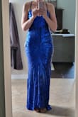 This dress is great! Very flattering. It is a bit short in front for me as I am 5'10". I will have to wear kitten heels or flats to make this dress work. The train is a bit annoying, but it is so pretty that I am going to keep it for the ball we have scheduled. The sequins is quite scratchy, but that is to be expected from a sequins dress. - Amanda D.
