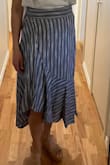 I really want to keep this, but the waist is a bit small and not stretchy. My poochy belly gets pushed down into a big dough ball when I sit and it isn't very comfortable. I may exchange for medium. - Natalie G.