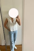 This top is light-weight amazing linen. The buttons look like nice quality which adds a good touch. It's a little cropped but can still be tucked in but will probably look better NOT tucked in. I think its great for work or for a day out with friends. - Julia F.
