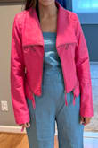 This jacket is fabulous in hot pink, but the reviews complaining about it being small didn't prove true for me. I wish I would've stuck with my true size because now I have to exchange it for a small. The pic is me in the bigger size. The jacket feels so nice... nicer than real leather in my opinion. Super stylish! I love that I can zip open the cuff if I want a more casual loose look or closed if I want a fitted polished look. Amazing jacket that I see myself wearing all year round for date night especially. Go for it; you won't regret it! - Marline K.