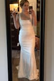 I bought this dress to try on for my elopement in August. It was shipped so quickly and exceeded my expectations! It fits almost perfectly. I am going to make the straps tighter; they are a bit too loose on my shoulders, and I need it hemmed as I'm on the shorter side and not wearing very tall heels. Other than that, it fits so well and the fabric is very nice, I also love that I won't have to worry about wrinkles. I love the vintage vibe of this dress; it is classy and timeless. The price is incredible for such a beautiful dress. - Megan H.