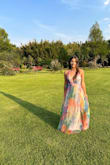 I bought this dress for a wedding in Mexico. It was too long, so I had it altered by a tailor, who also found a couple of holes in the exterior fabric. Thankfully, they weren't very visible. Just before the wedding, one of the straps broke, which was very stressful. My boyfriend helped me find a temporary fix, as shown in the second picture. Despite these issues, the dress is beautiful and I received many compliments. - Sofia S.