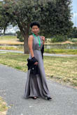 This dress is fabulous! The silver gray colour was perfect in a cloudy, coastal environment. The slits were modest & revealing. The only qualm I have is that the mock neck was loose & I needed to safety pin the back for a closer fit. Not perfect, but will get it altered at a later time. Otherwise, true to size & perfect for what I needed. Recommend dry cleaning - Kamm S.