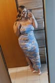 I absolutely love this dress! I am usually very self-conscious in tight-fitting clothes as I am curvy, but this fit perfectly and hugged the curves wonderfully! It does go to my ankles as I am short, but it's perfect. I could've sized to a L but did an XL just to be safe. The ruching is SO forgiving. I wore it without a bra and it's just chefs kiss! - Jordan F.