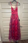 Beautiful dark pink color.  And I liked that it wasn't a true floral pattern.  However, it fits small.  I personally didn't like how the bottom fits more "poofy" than pictured.  Had to return due to it not fitting me around the waist. - Amanda W.