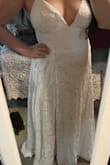 My fiancé and I decided to elope at the last minute, and this dress was delivered fast. It is basically what I expected - the dress is lined and the lace overlay is thicker than I thought. I recently gained weight so I wanted something that would hide that. The high waistline is great for that. The cups are padded which is great if you don't want to wear a bra. Having A cups, though, they are a little big, but not too big. The straps are a little awkward with the "X' formation in the back, but it'll be better once I adjust it to fit my short torso. The little clasp at the top of the zipper is fairly easy to close myself. I won't have enough time to have this dress altered, so I am going to try to wear at least 4" heels and maybe safety pin the bottom. The slit at the bottom is nice and comes to about mid-thigh. I bought the silver rhinestone belt from Lulus to accessorize on the big day. - Brittney S.